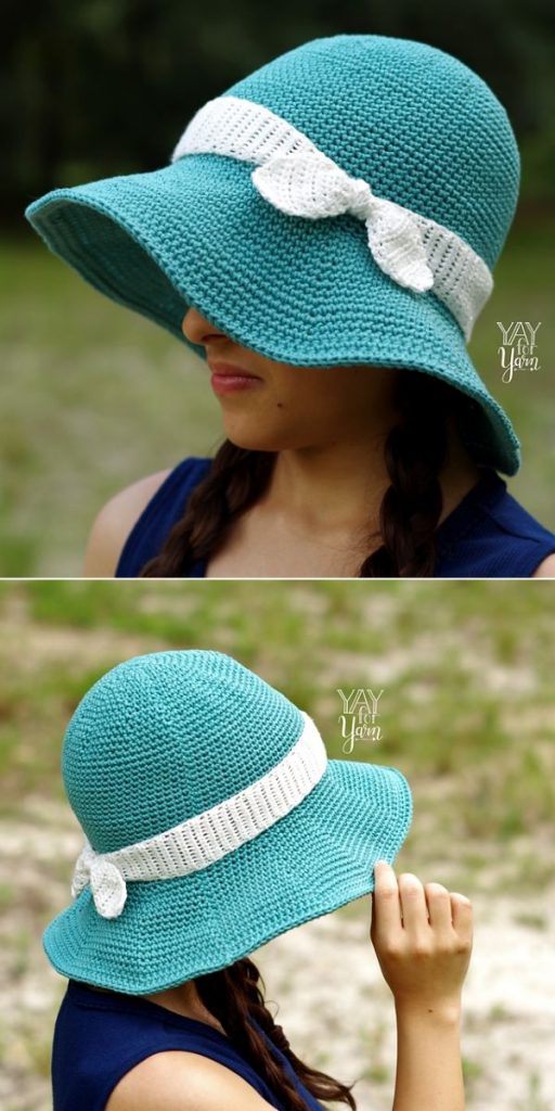 woman in teal hat