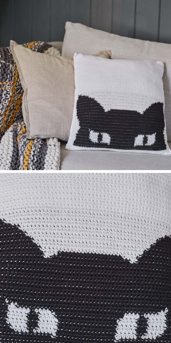 crochet pillow with black cat half head on it
