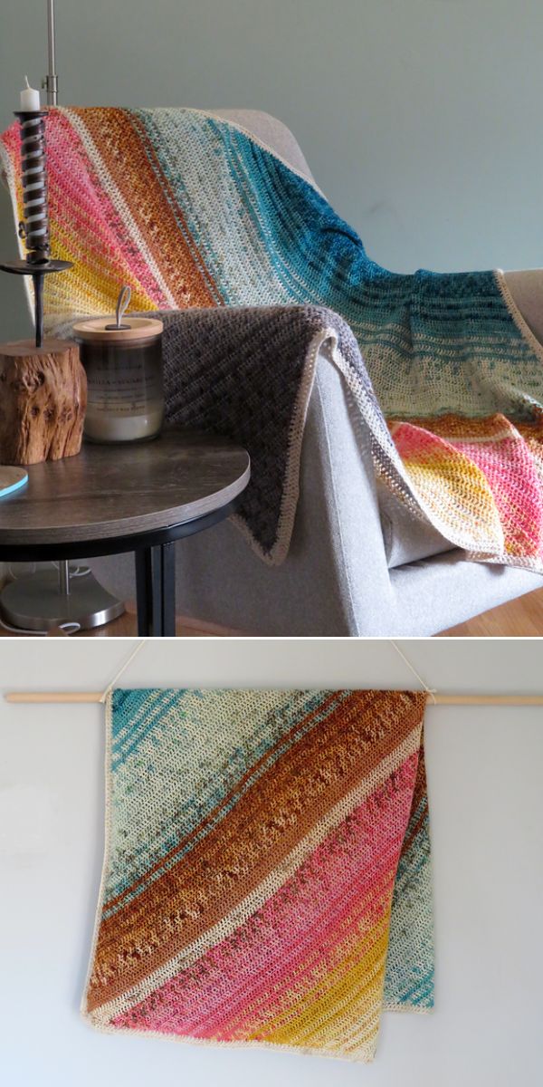 multicolored crochet striped blanket made from corner to corner laying on the grey armchair