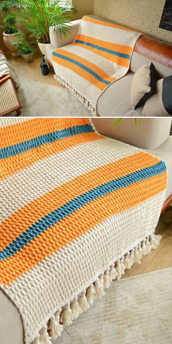 crochet stripe afghan in beige orange and blue colors laying on the beige couch