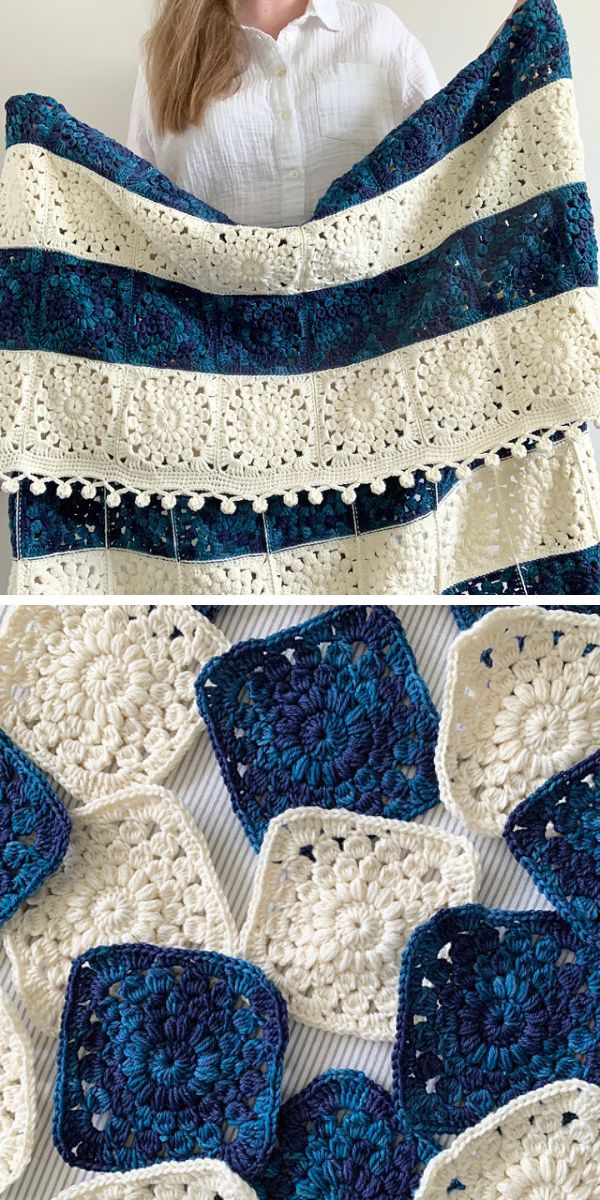 a woman presenting a crochet blanket with lines of white and dark blue sunburst crochet squares