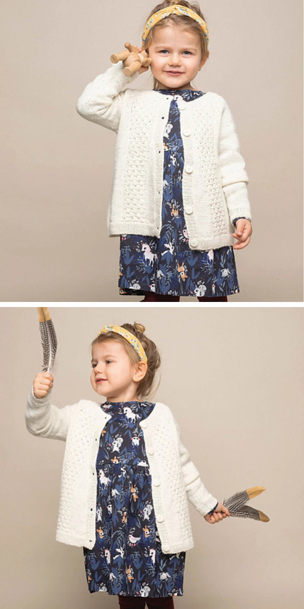 white baby cardigan on a toddler girl