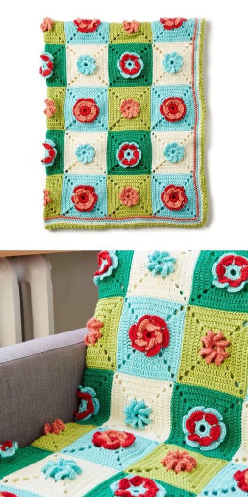 a crocheted granny square afghan with flower motif