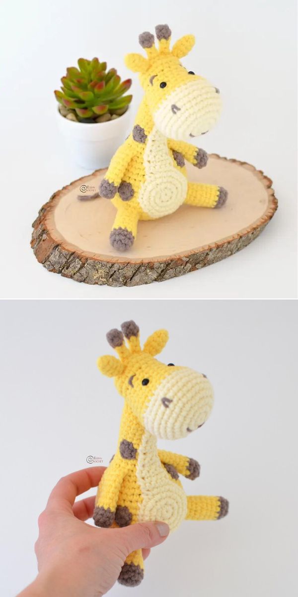 a crocheted giraffe amigurumi laid on a piece of wood and held by a person in hand