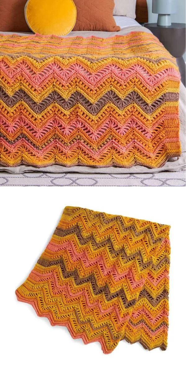 crochet ripple blanket in orange hues laying on the bed