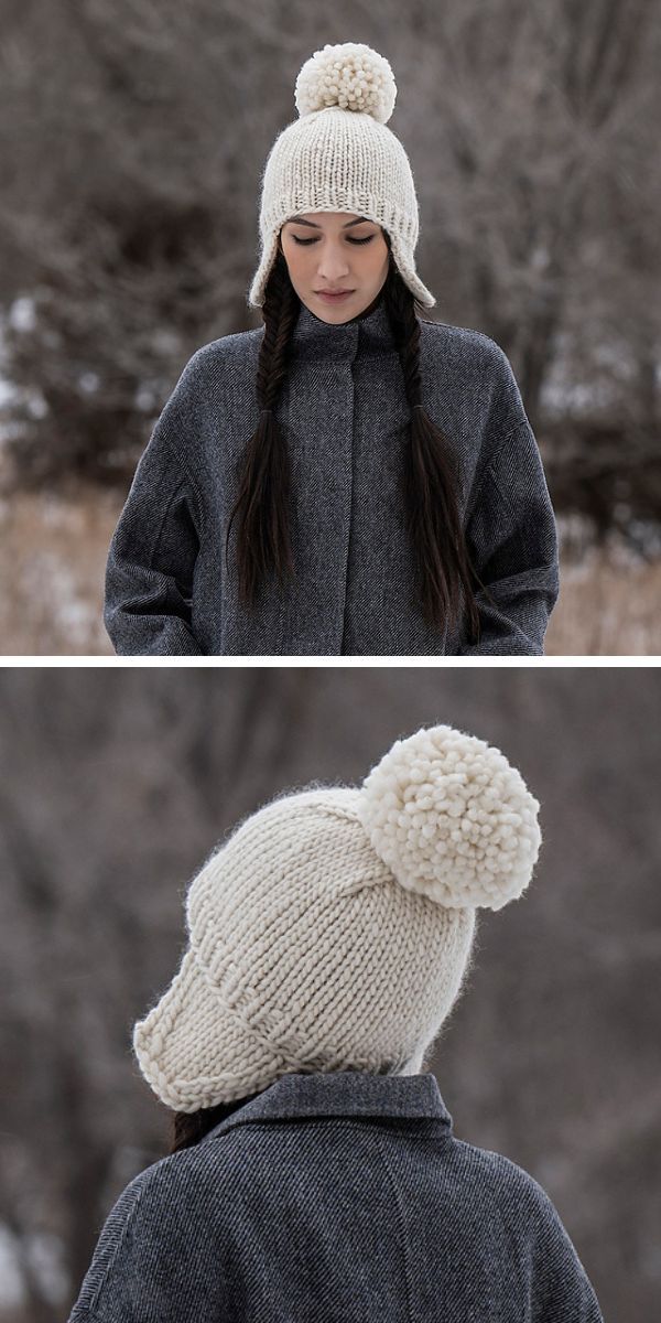 white knitted hat with a big pom pom on a woman in dark grey coat