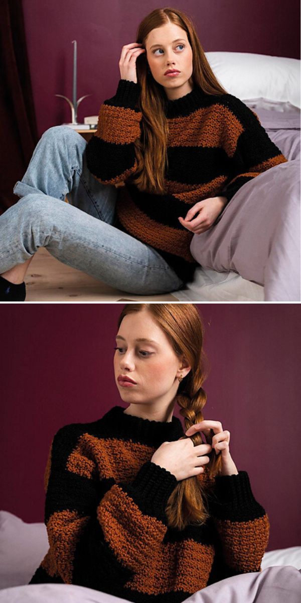 A woman is sitting on a bed wearing a sweater.