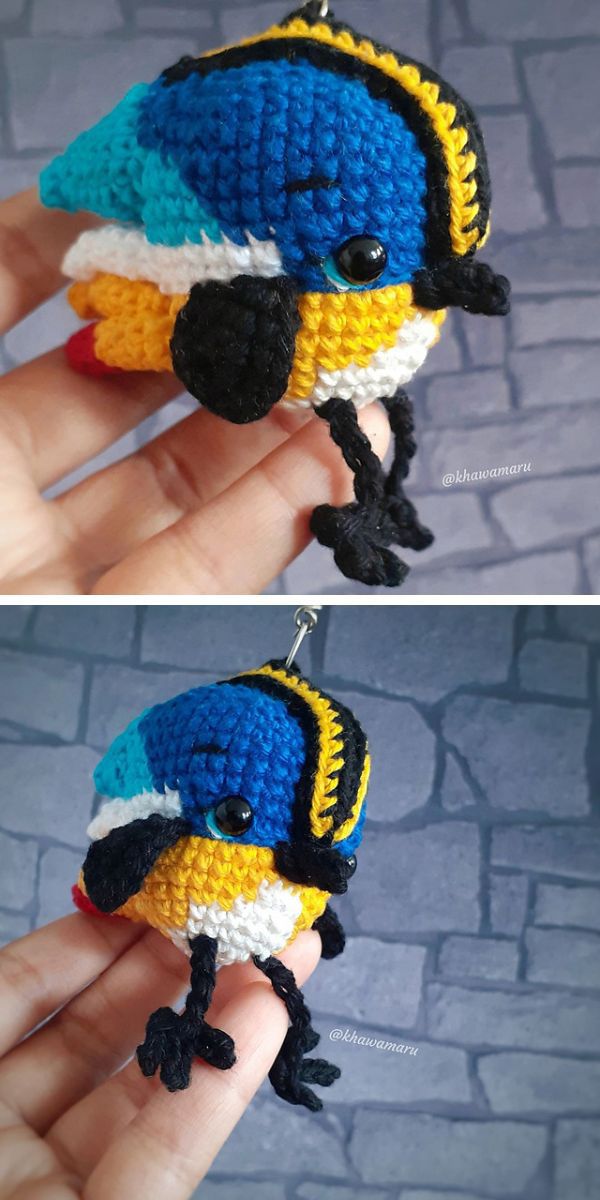 A crocheted bird with blue and yellow colors.