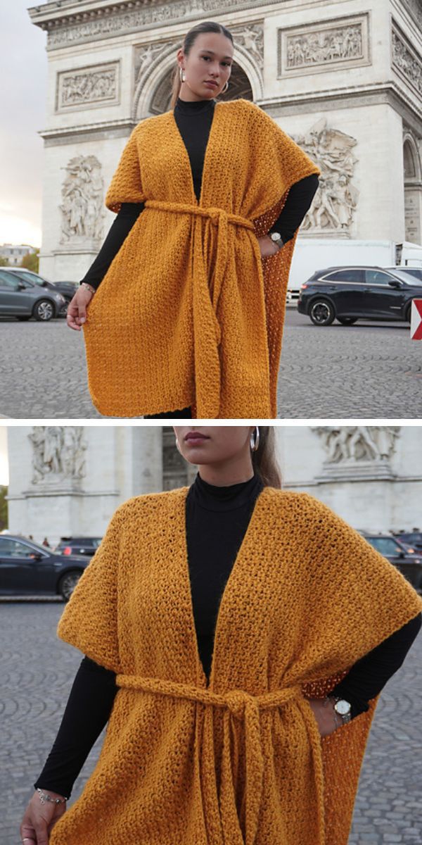A woman wearing a crochet ruana in front of the Arc de Triomphe.