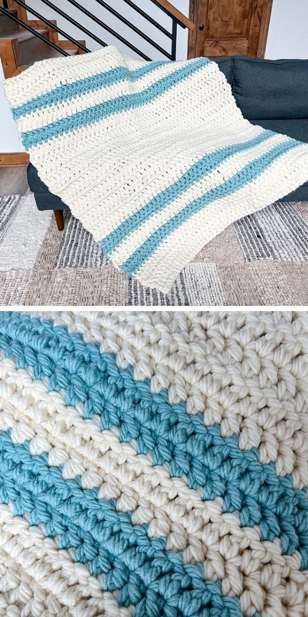 A blue and white chunky crocheted afghan on a couch.