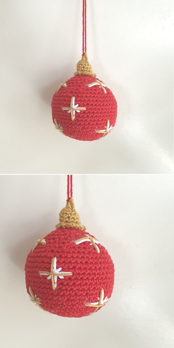 A red crochet ornament hanging on a wall.