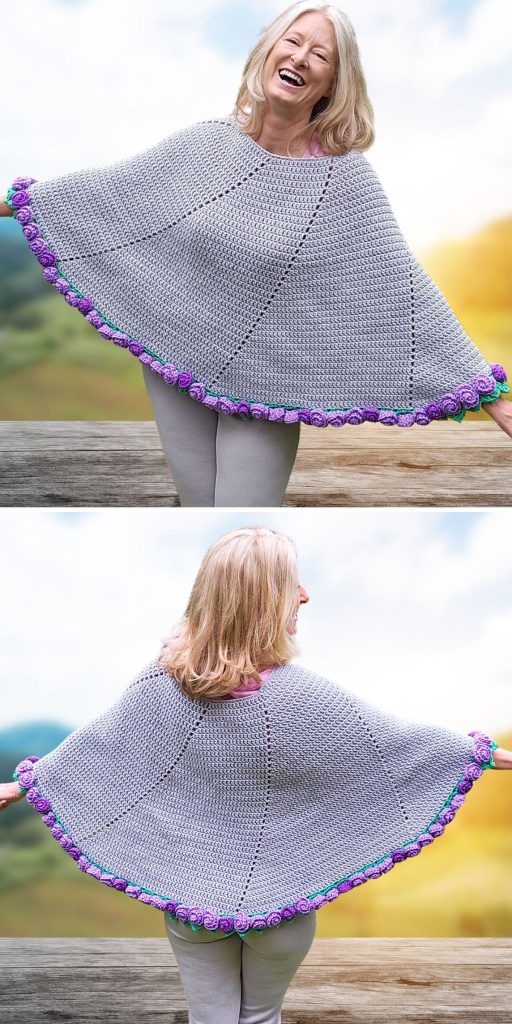 A woman smiles and poses outdoors in a grey crochet poncho adorned with vibrant purple and green floral trim, showing off the stylish garment from both the front and back.