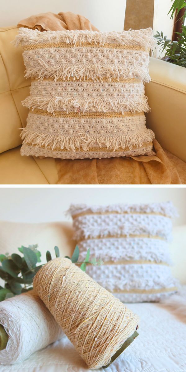 Two crochet pillows with bobbles, adorned with a spool of yarn.