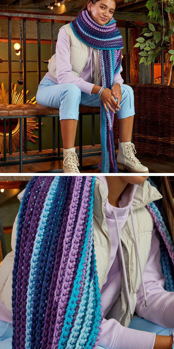 A woman is sitting on a bench wearing a crocheted scarf.