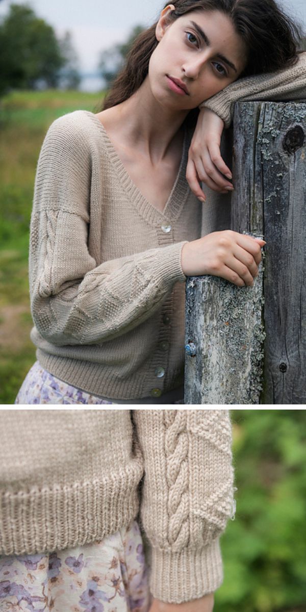 A woman is leaning against a fence wearing a sweater.