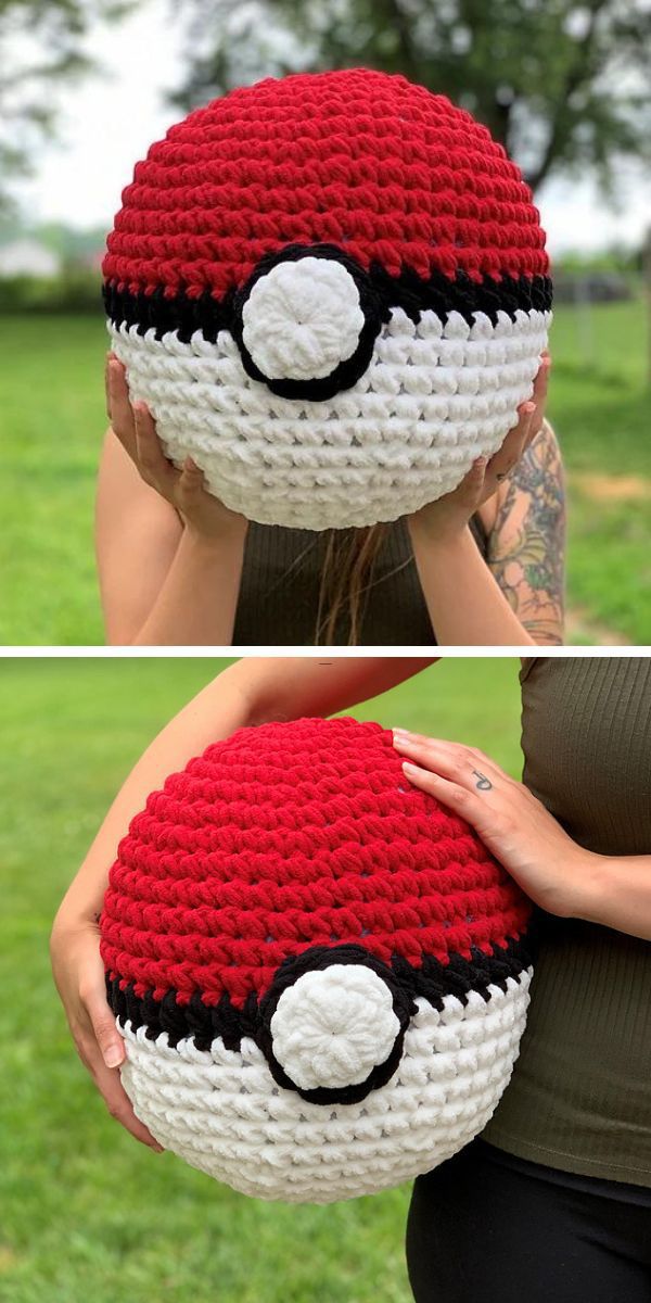 A crocheted pillow with a pokeball design.