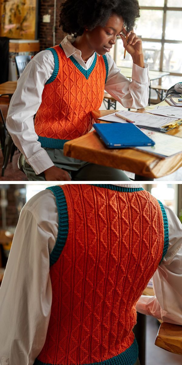 A woman is sitting at a table wearing an orange vest.