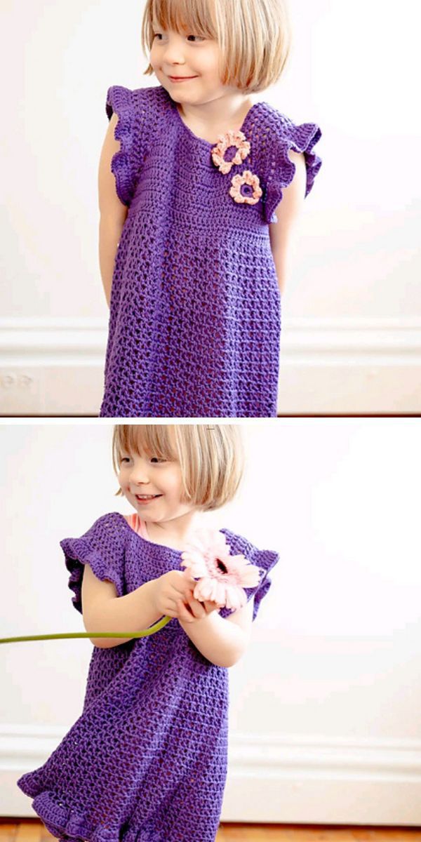 a little girl wearing a crochet purple dress with two crochet flowers on it