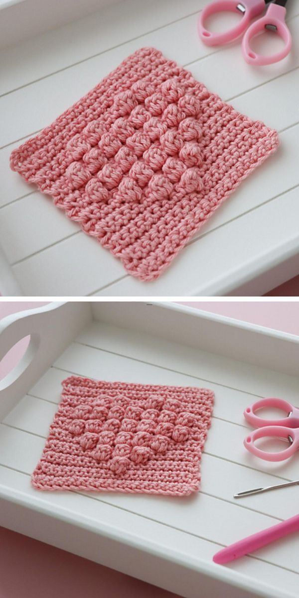 a pink crochet square featuring a heart  motif made with the bobble stitch