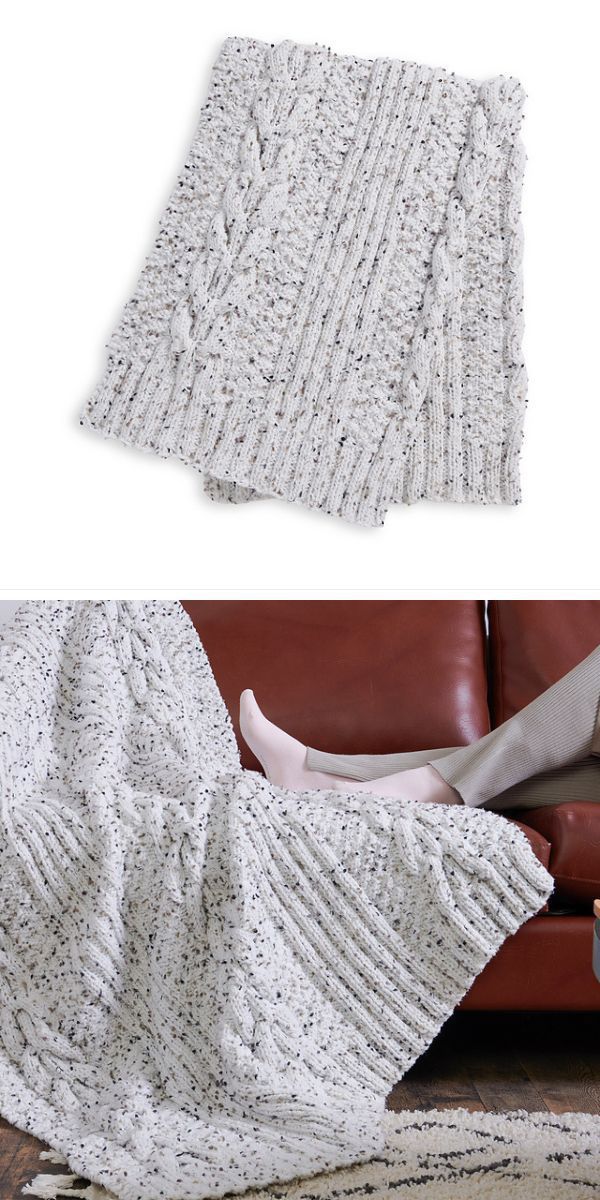 a knitted blanket with a cabled design in a light color