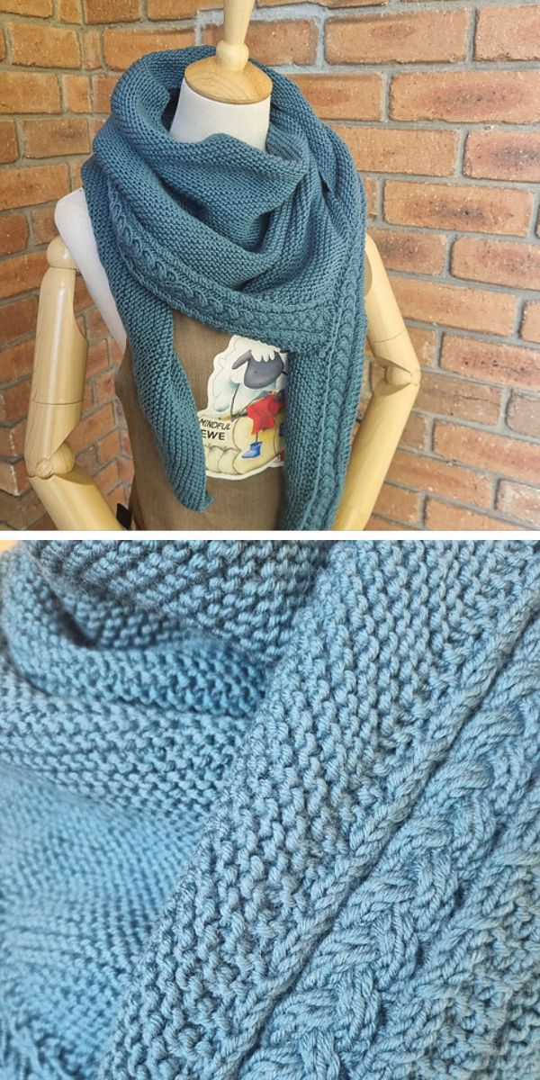 a blue knitted shawl with a braided edge