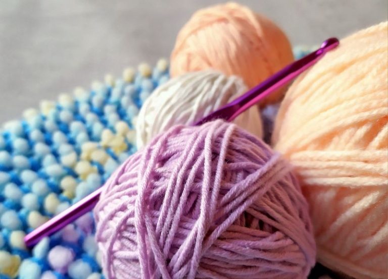 skeins of yarn with a crochet hook