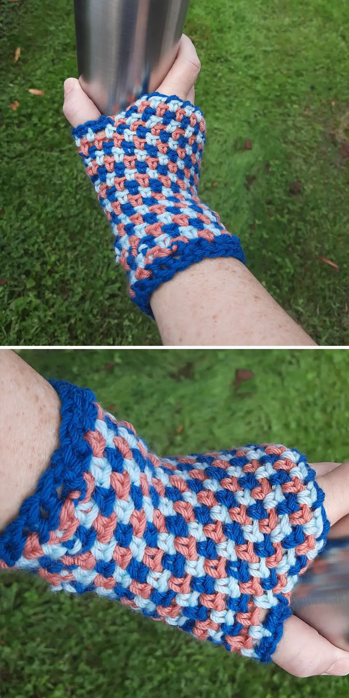A hand adorned with crochet fingerless gloves in a blue, pink, and white pattern clutches a metallic object outdoors on the grass.