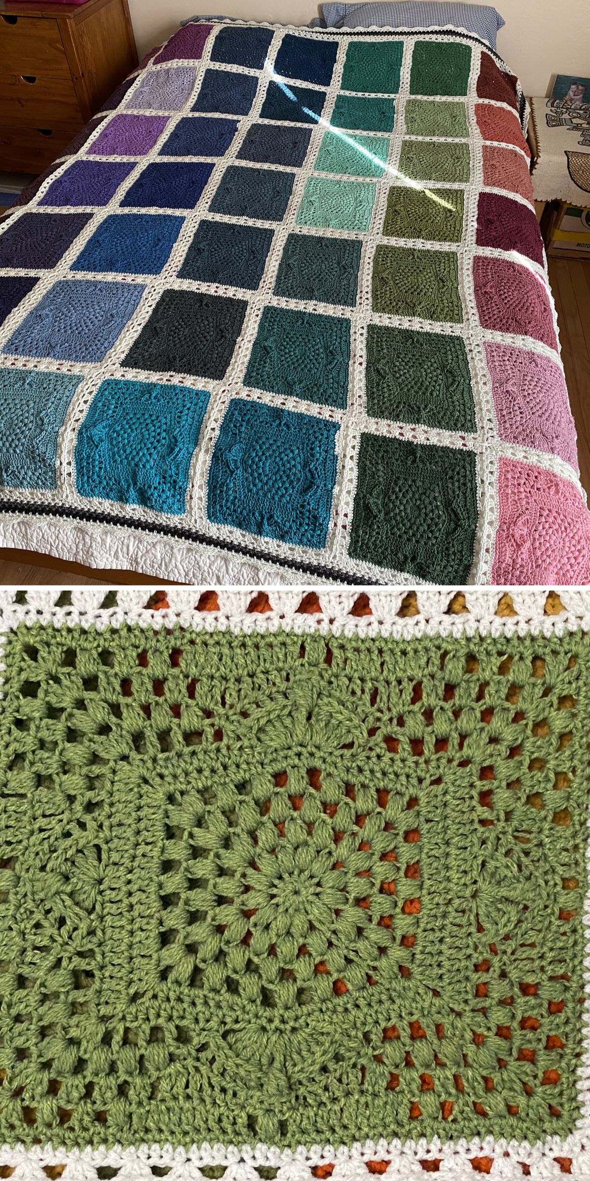 a crocheted blanket made of large colorful squares seperated by a white border
