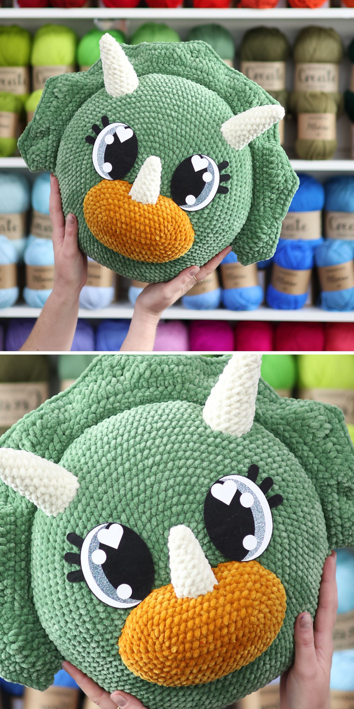 a large squishy crochet pillow shaped like a dinosaur head