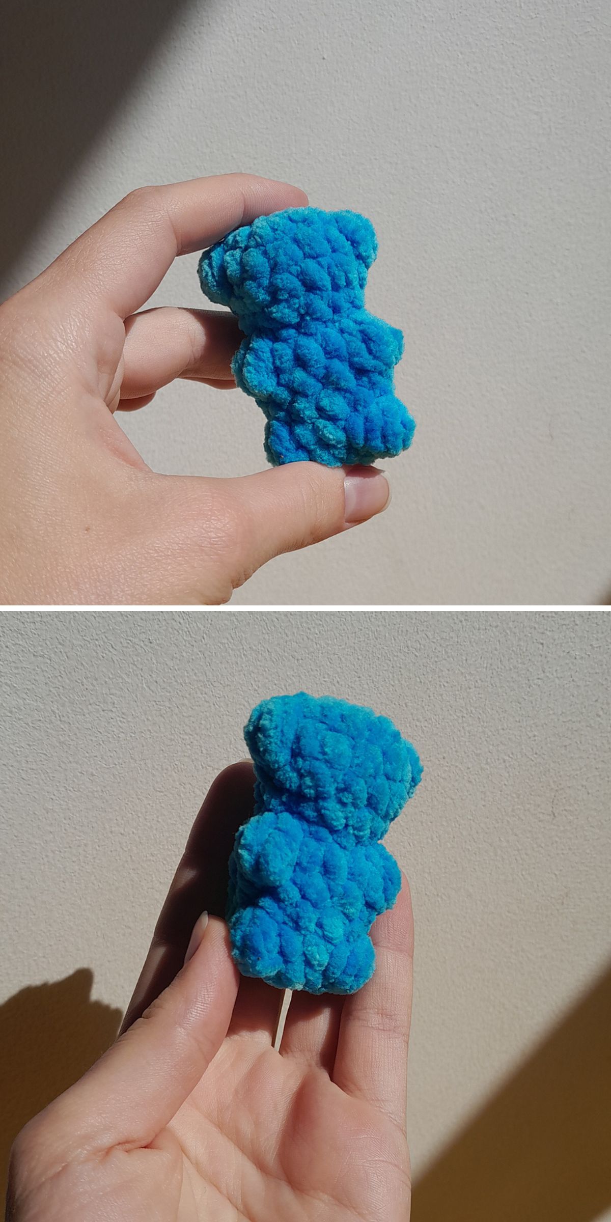 a tiny crochet gummy bear in blue