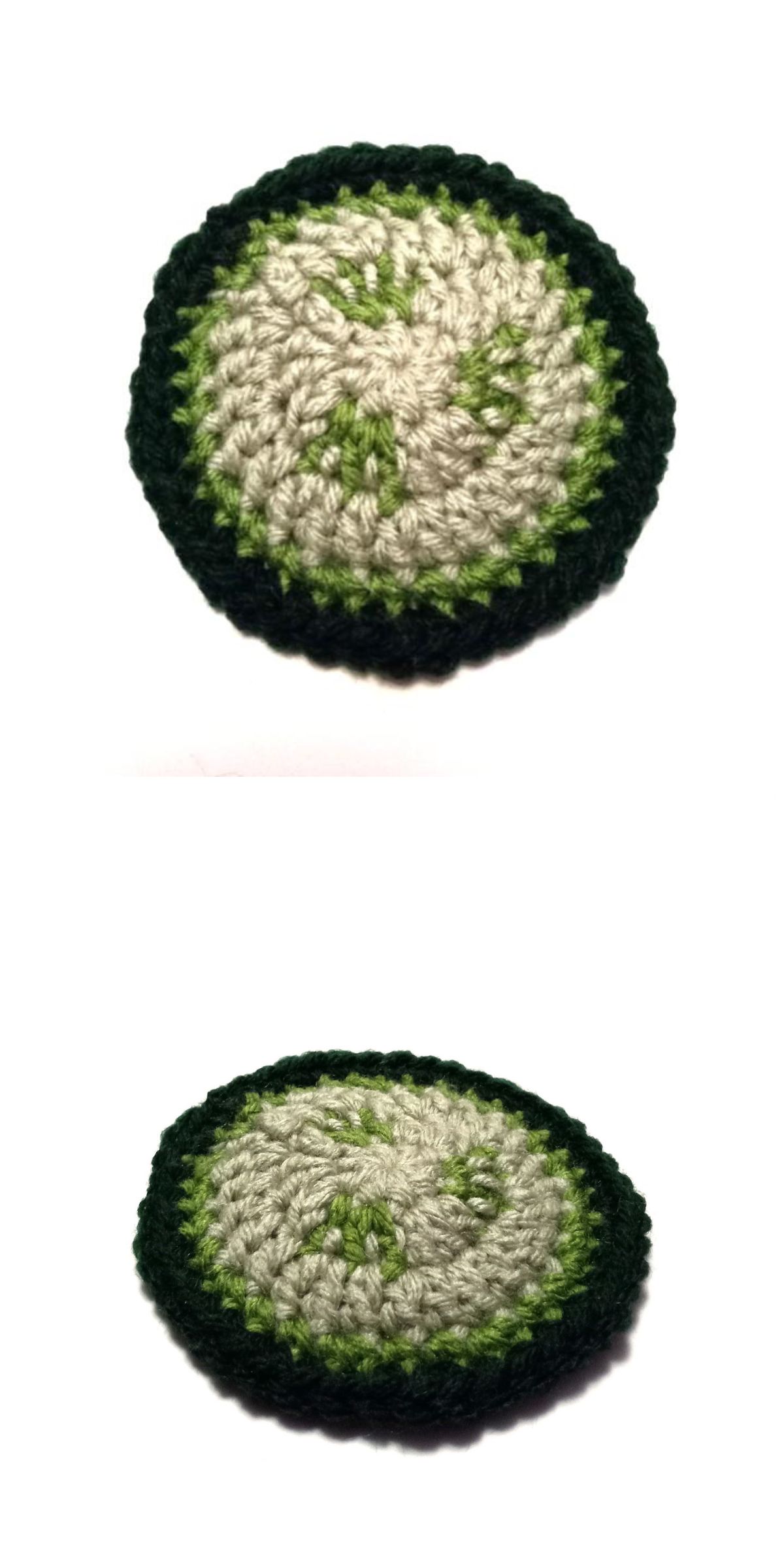 a round crochet coaster in green shades