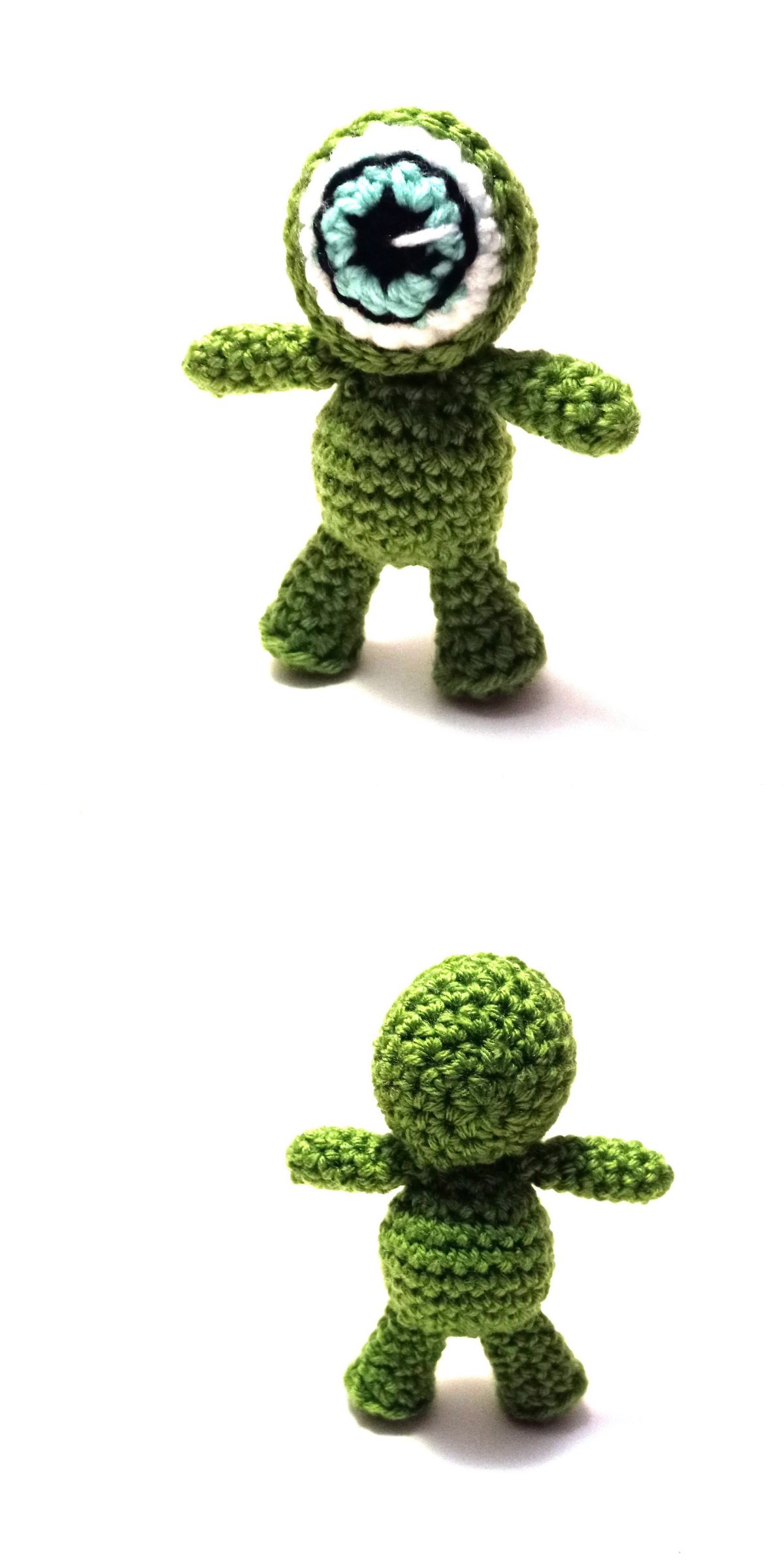 a crochet green monster with a big eye that serves as his head