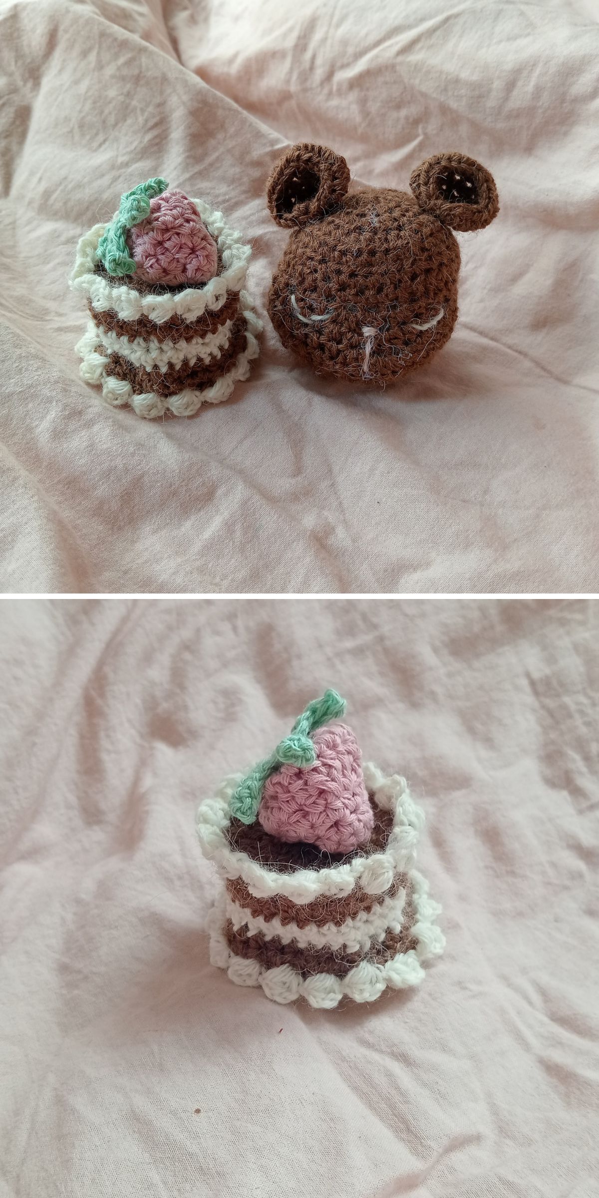 Two crochet amigurumi food items are displayed on pink fabric: a brown bear head and a small cake with white and brown layers topped with a pink strawberry. The second image features just the crocheted cake.