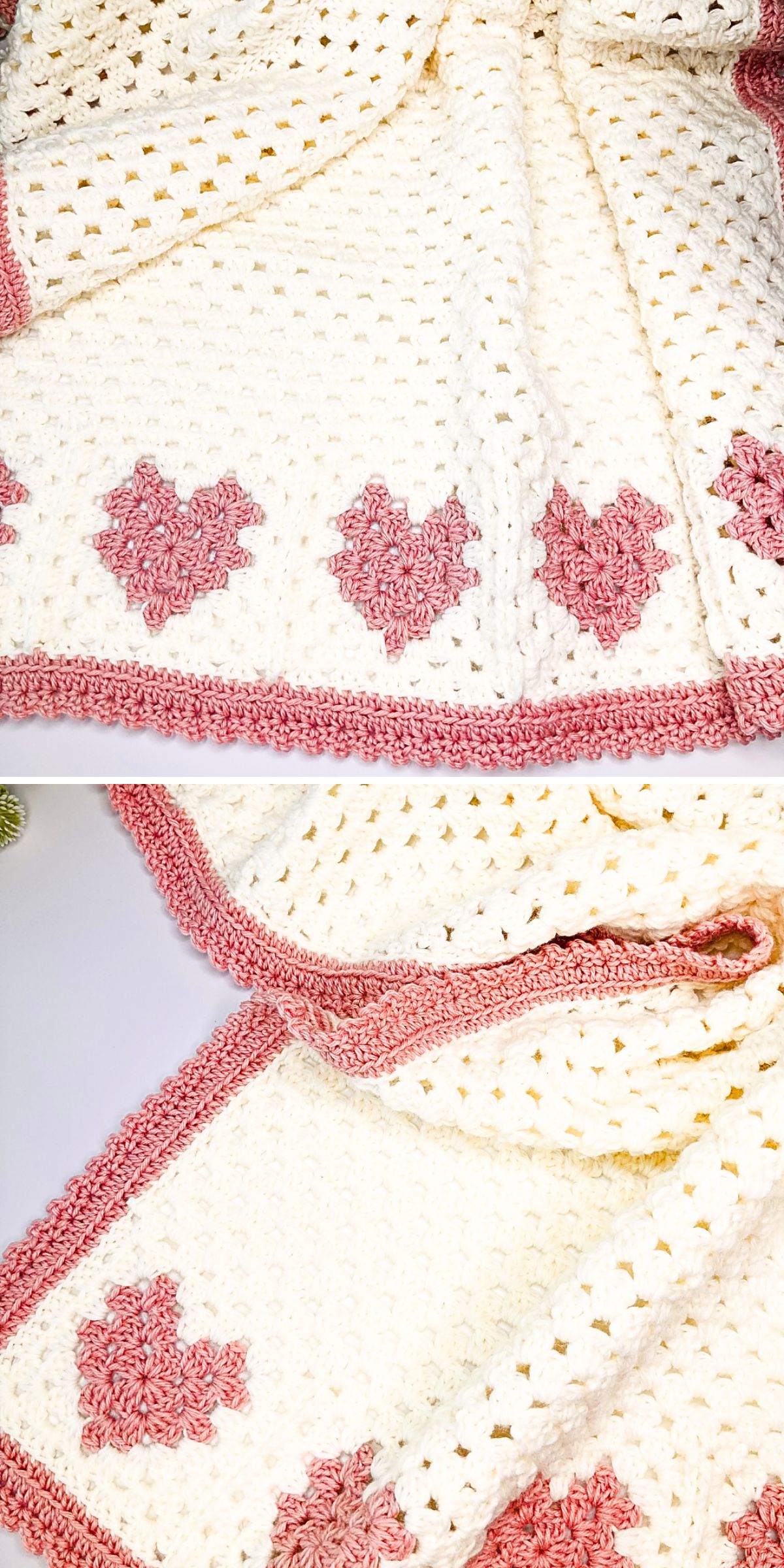 A crochet granny square blanket in white, featuring pink heart patterns along the edge and a pink border, is laid out on a flat surface.