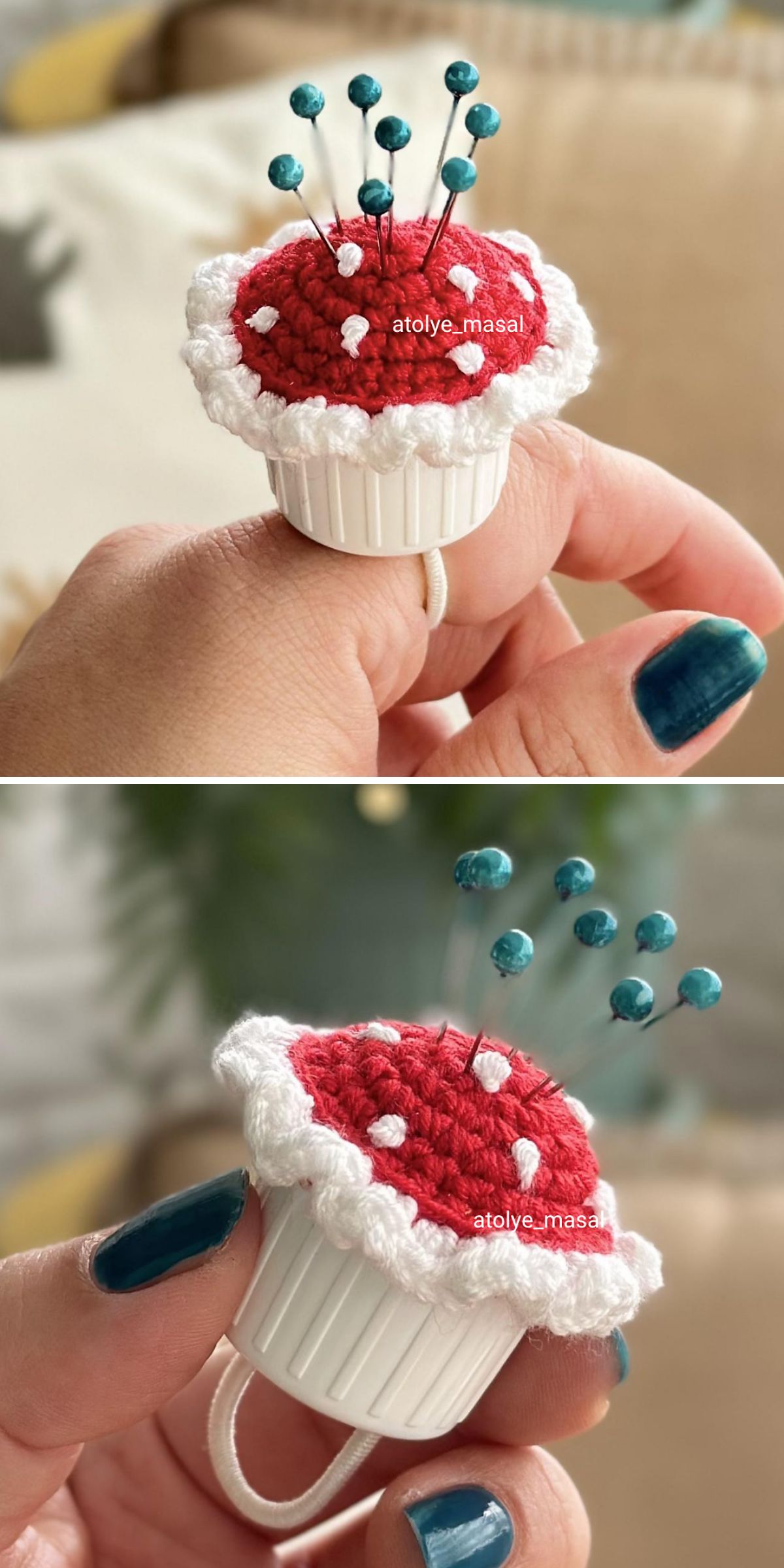 A hand holds a crochet pincushion shaped like a cupcake, with a red top, white edge, and multiple pins inserted. This charming crochet pincushion is cleverly worn as a ring.