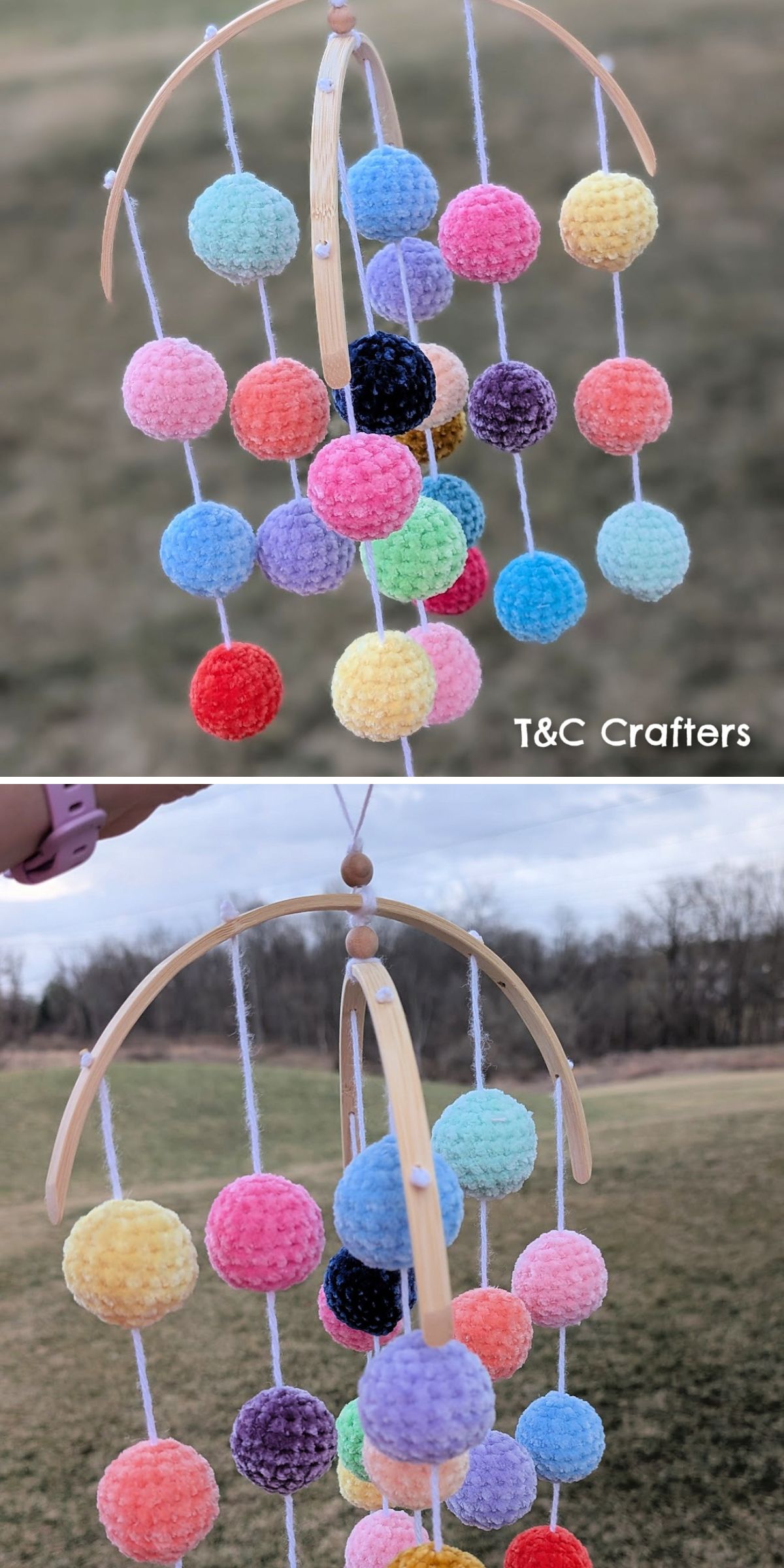 A handmade crochet baby toy mobile with colorful crocheted balls hanging from wooden hoops, displayed outdoors against a grassy background.