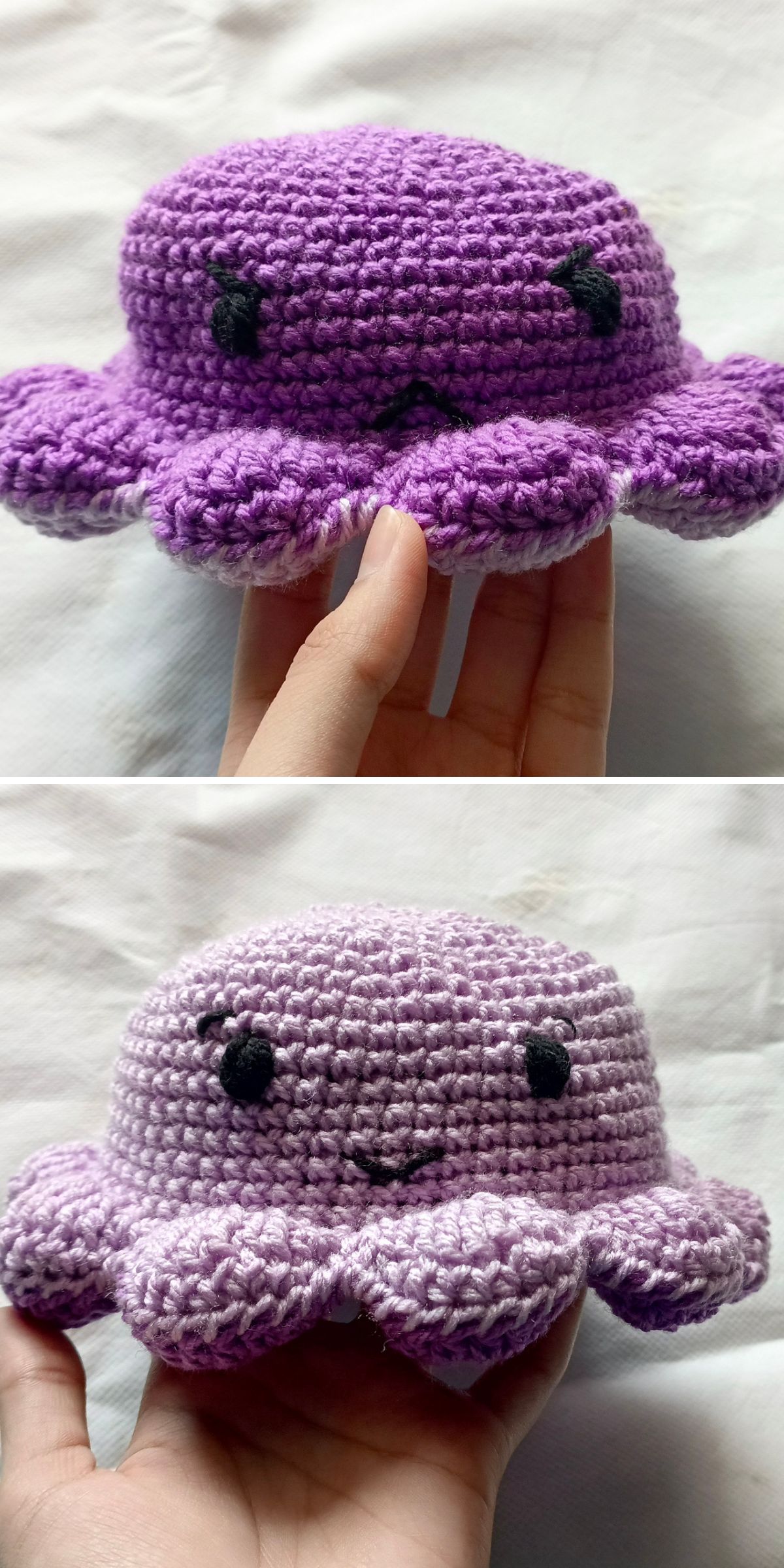 A hand holds a reversible, tiny octopus amigurumi plush crocheted in purple, featuring a sad face on one side and a happy face on the other.
