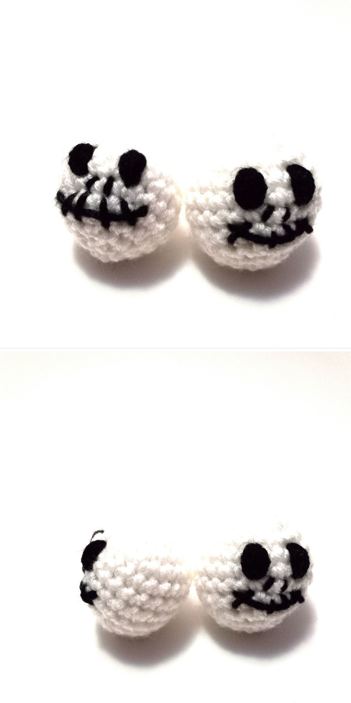 Two small crocheted white skulls with black stitched facial features are shown from the front and side on a plain white background, perfect as a crochet Halloween applique for your spooky projects.