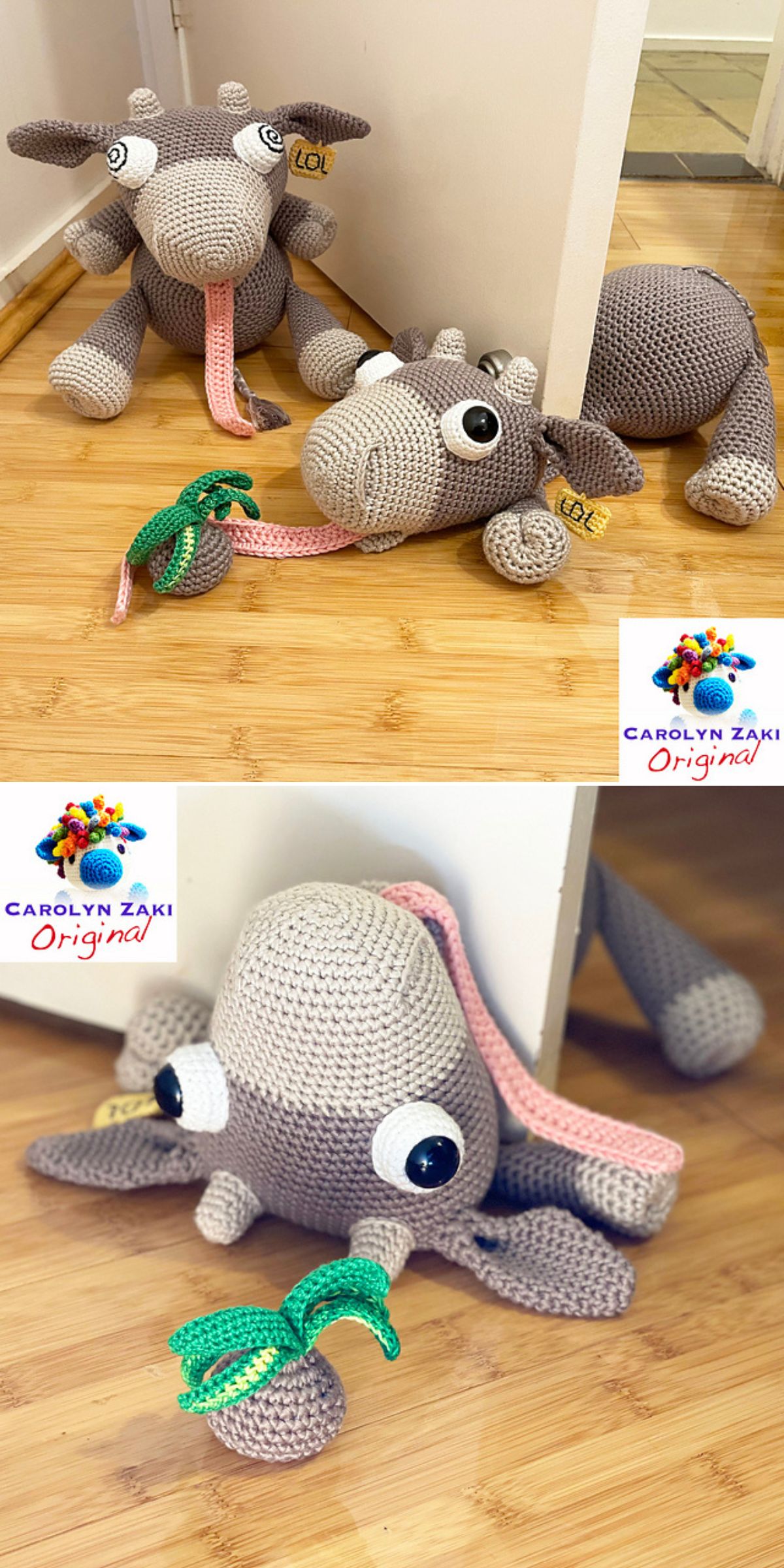 Two crocheted cow plush toys with long necks and large eyes lie on a wooden floor near a white wall, one holding a green crocheted leaf and serving as a door stopper. A crochet cow from Carolyn Zaki Original branding is also visible nearby.