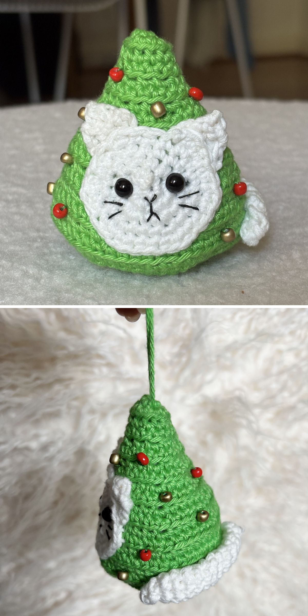 A crochet Christmas tree ornament in green, shaped like a tree with a white cat face, decorated with red and gold beads, shown both upright and hanging by a string.