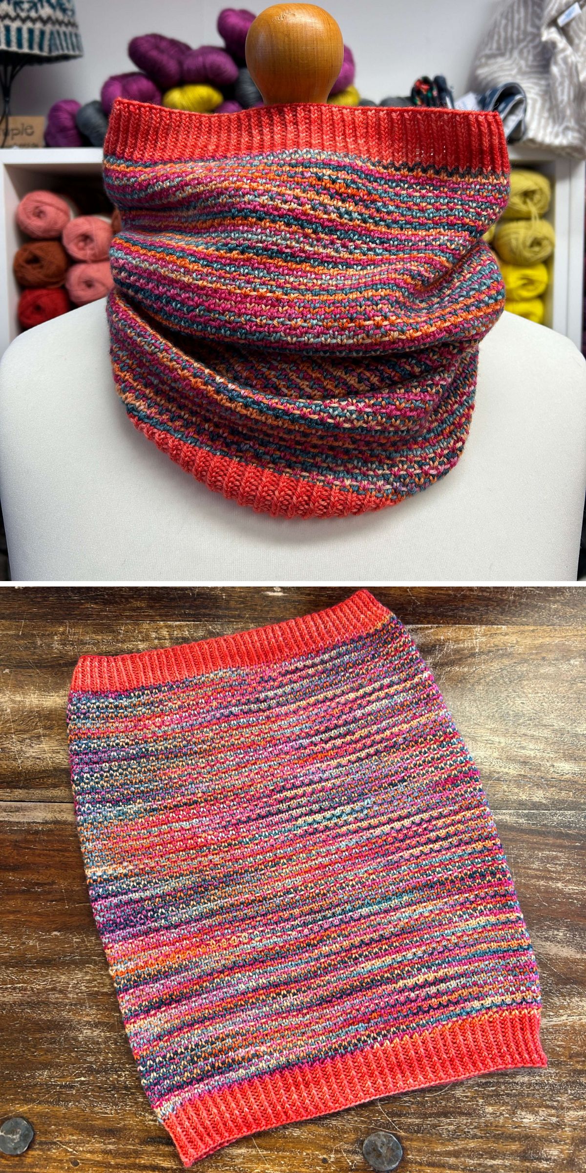 A multicolored knitted cowl with red edges is displayed on a mannequin and laid flat on a wooden surface, highlighting the cozy knitwear among yarn shelves in the background.