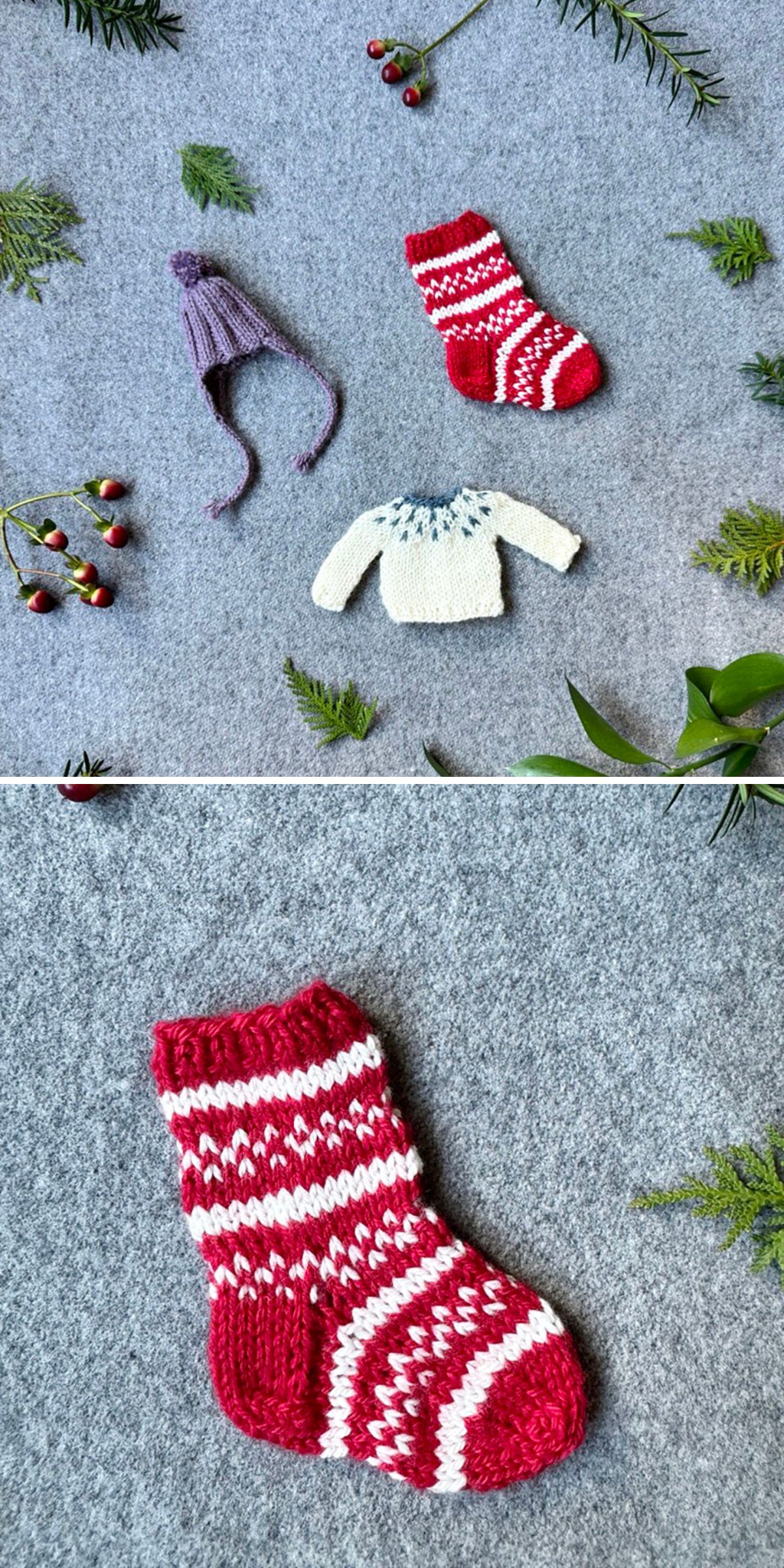 Miniature knitted hat, sweater, and stocking with festive patterns are arranged on a gray surface, surrounded by greenery, red berries, and shimmering Christmas baubles.