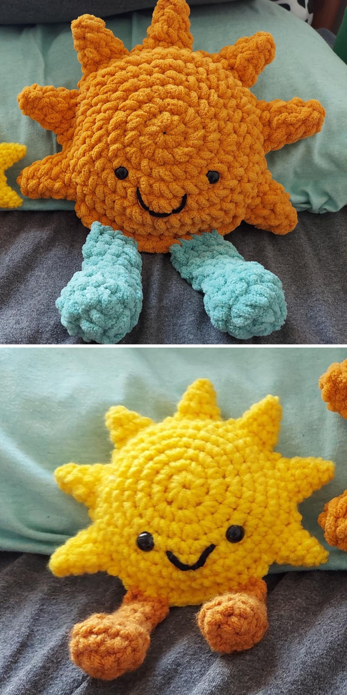 Two crochet sun plush toys with smiling faces are shown, one with blue legs and the other with orange arms, placed on a bed with a blue pillow in the background.