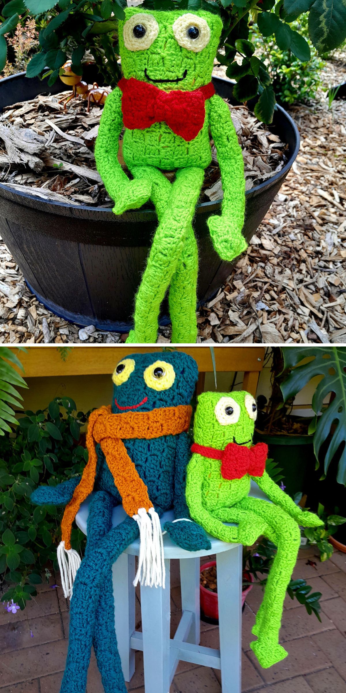 Two crochet frog dolls, one green with a red bow tie and one blue with an orange scarf, sit outdoors on a pot and a stool among plants.