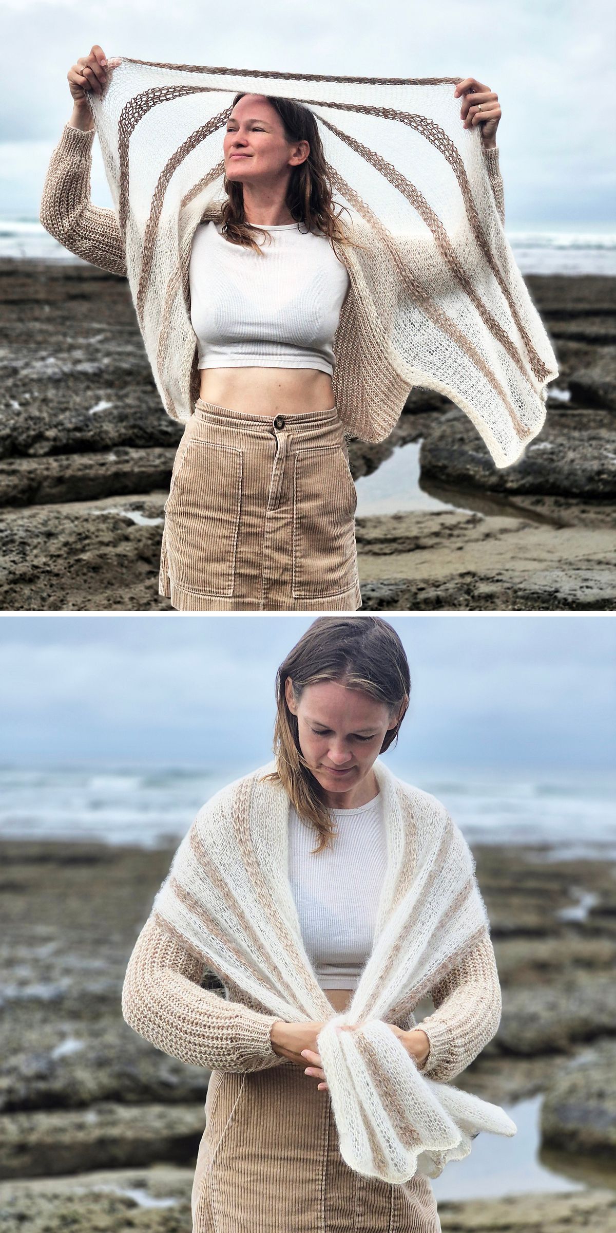 A person stands on rocky terrain by the sea, wearing a cream cardigan and holding a beige and white striped knit shawl — an embodiment of stylish comfort perfect for those who love modern cardigans.