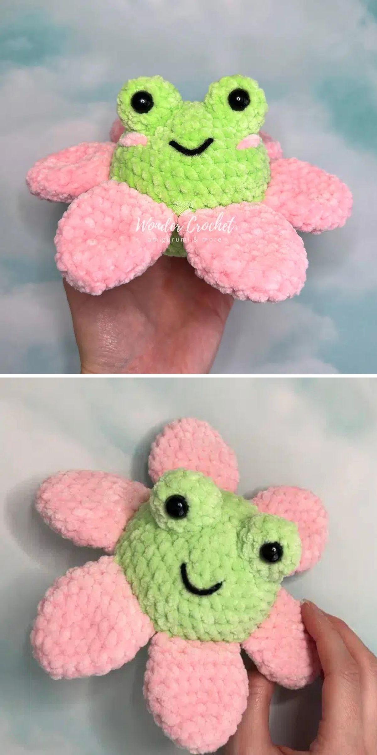 A hand holds a plush crochet frog toy with large eyes and five pink petals around its body, resembling a flower.