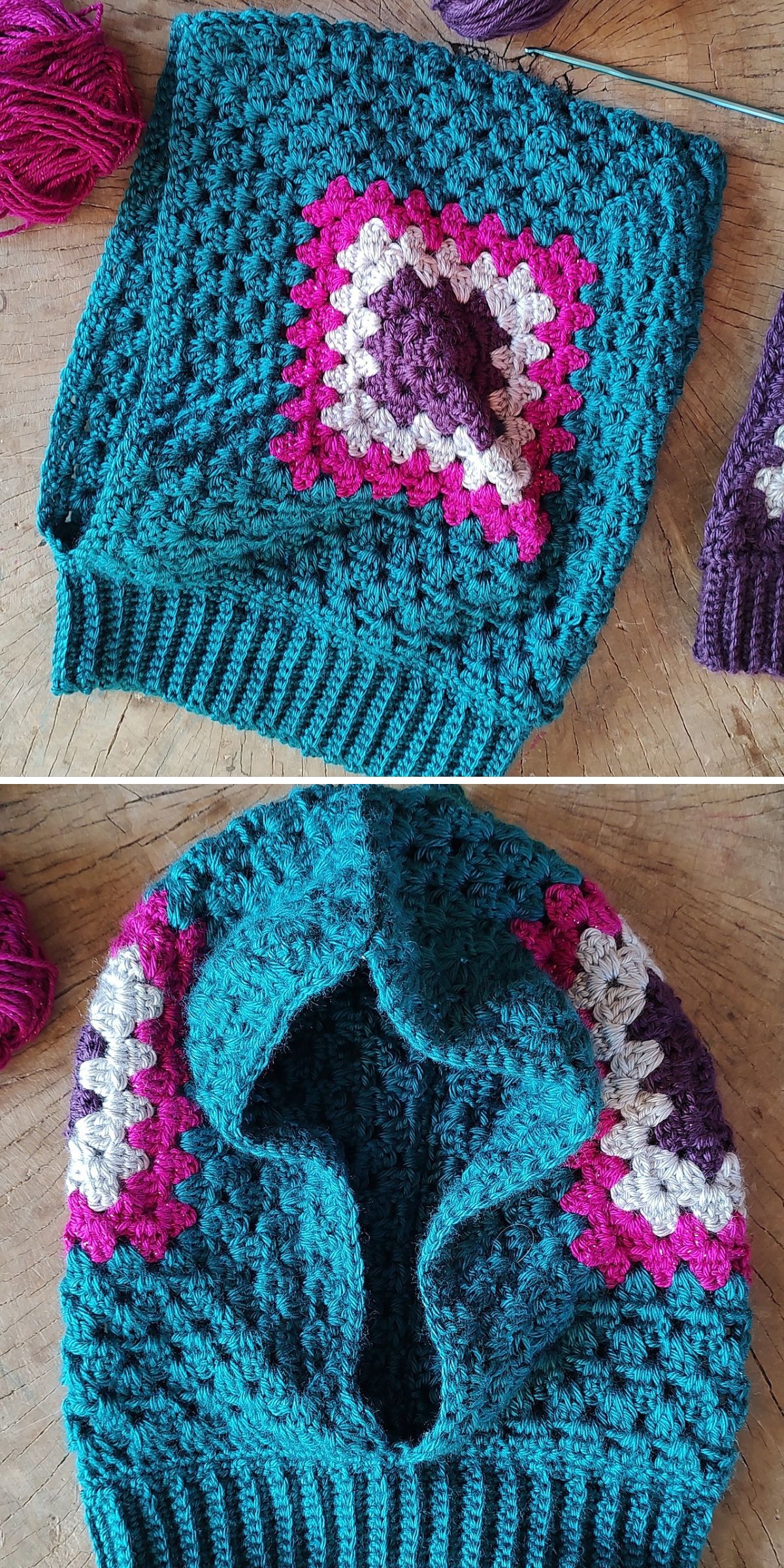 A crochet hood balaclava with teal, purple, pink, and white granny squares is shown folded and laid flat on a wooden surface.