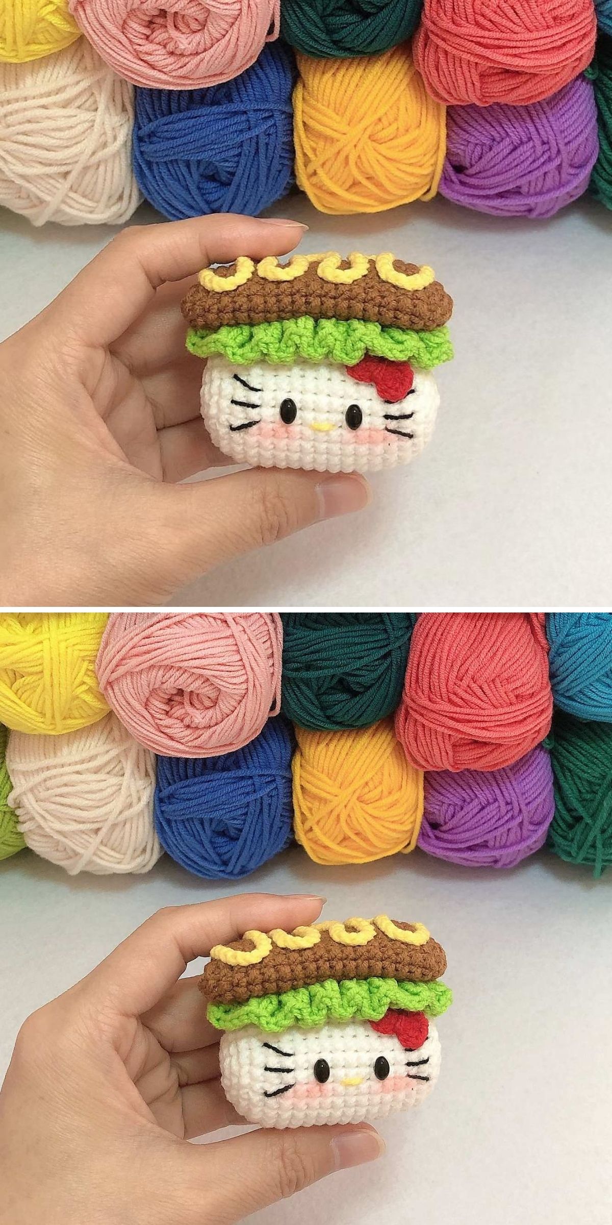 A hand holds a crochet cat amigurumi inspired by Hello Kitty, designed to resemble a sushi roll, with colorful yarn balls stacked in the background.