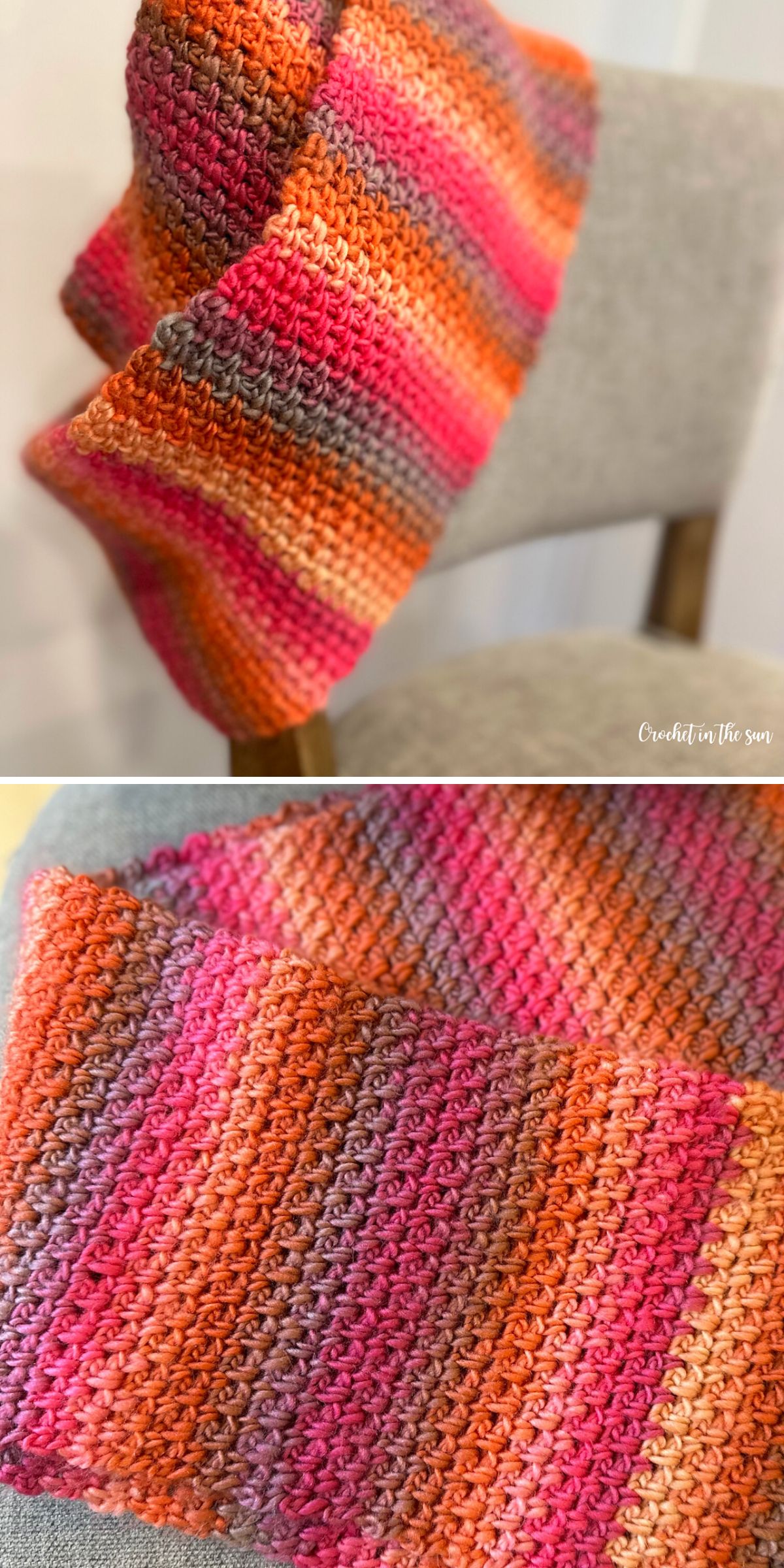 A Crochet Infinity Scarf with horizontal stripes in shades of orange, pink, red, and gray is draped over a light-colored chair.