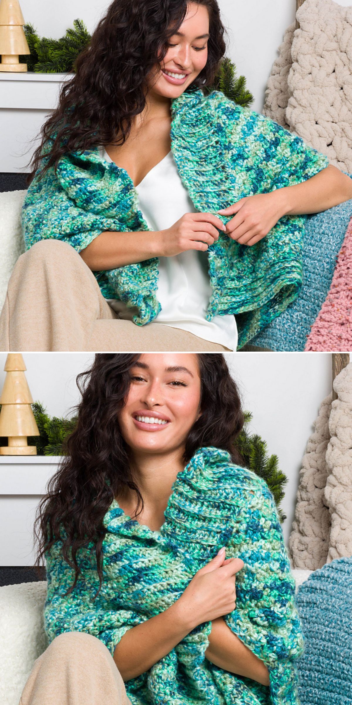 A woman with long dark hair sits on a couch, wrapped in a chunky green and blue crochet cardigan over a white top and beige pants, smiling in a cozy indoor setting.